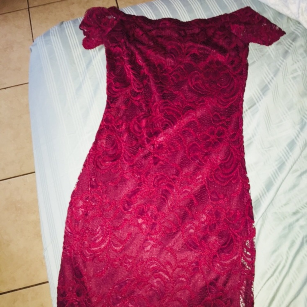 A velvet like , tight and laced dress